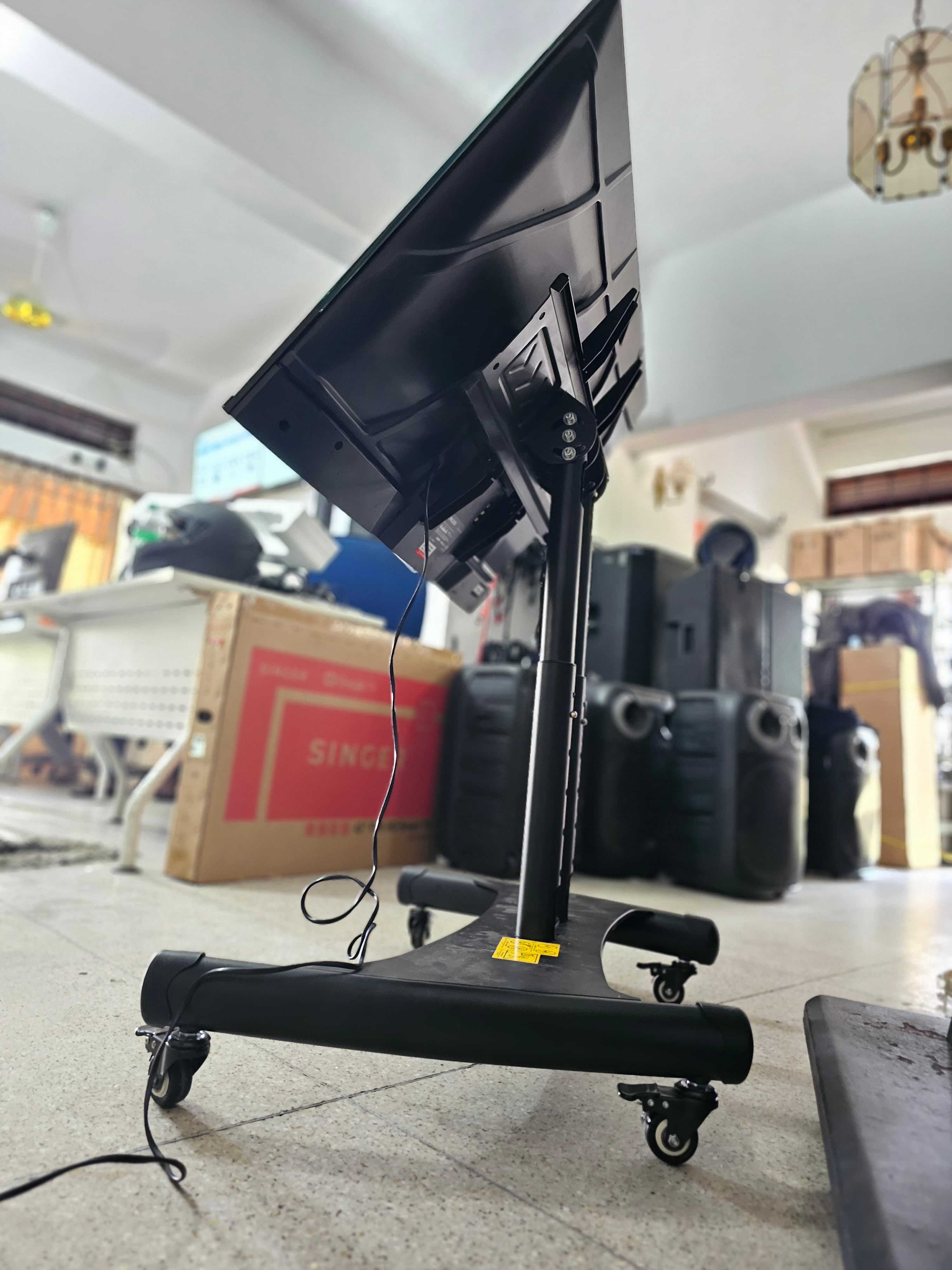 Trolley Movable Heavy Duty TV Stand 55"-75" in action 8