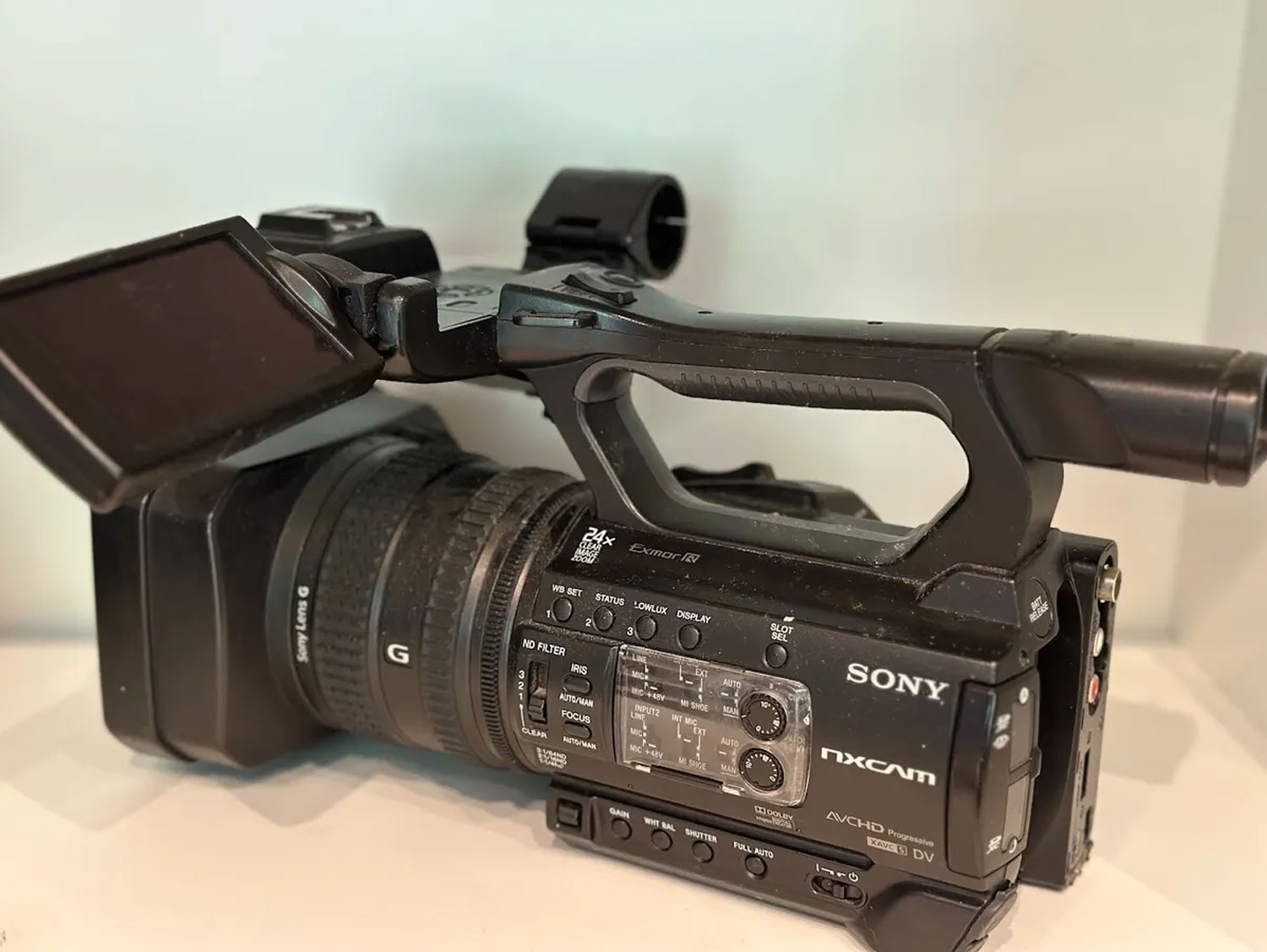 Sony HXR-NX100 Camcorder showcasing lens zoom capability